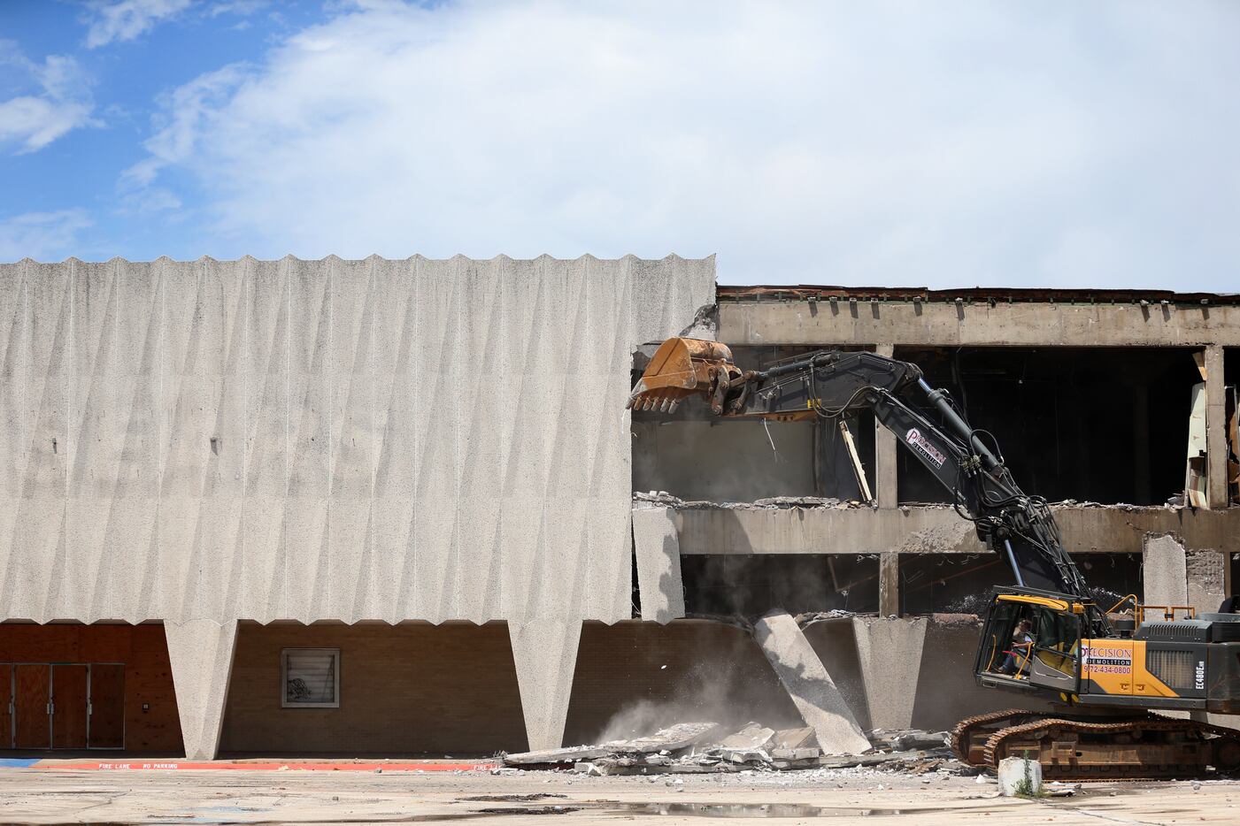 Construction crews demolish the old Sears store at Valley View Mall in Dallas.