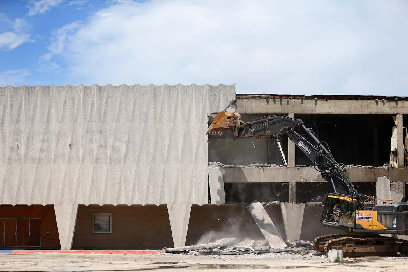 Construction crews demolish the old Sears store at Valley View Mall in Dallas.