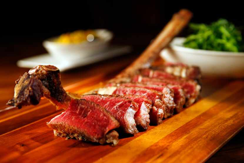 A 32-ounce, 90-day dry-aged long-bone ribeye called the 'Battle Axe' at Town Hearth goes for...