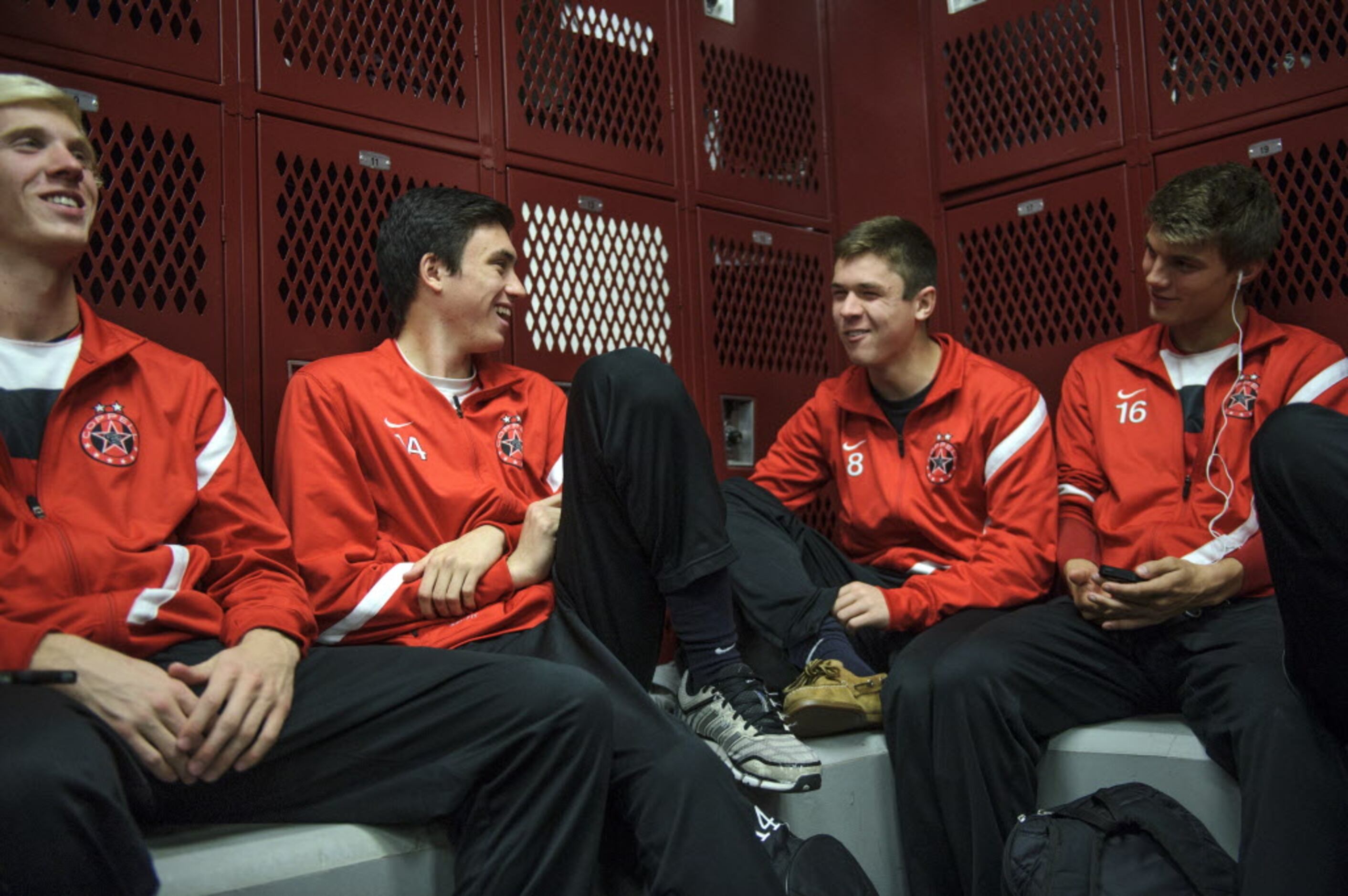 Kellen Reid (second left), a senior at Coppell High School and a captain of the soccer team,...