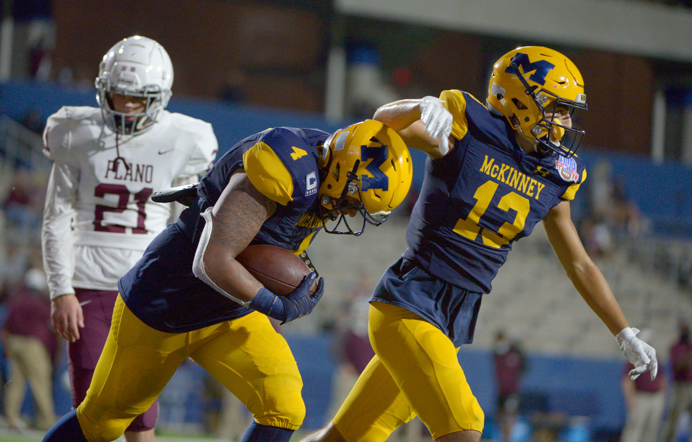 McKinneyÕs Joshua Dixon (4) and Cameron Rivas celebrate DixonÕs second quarter touchdown...