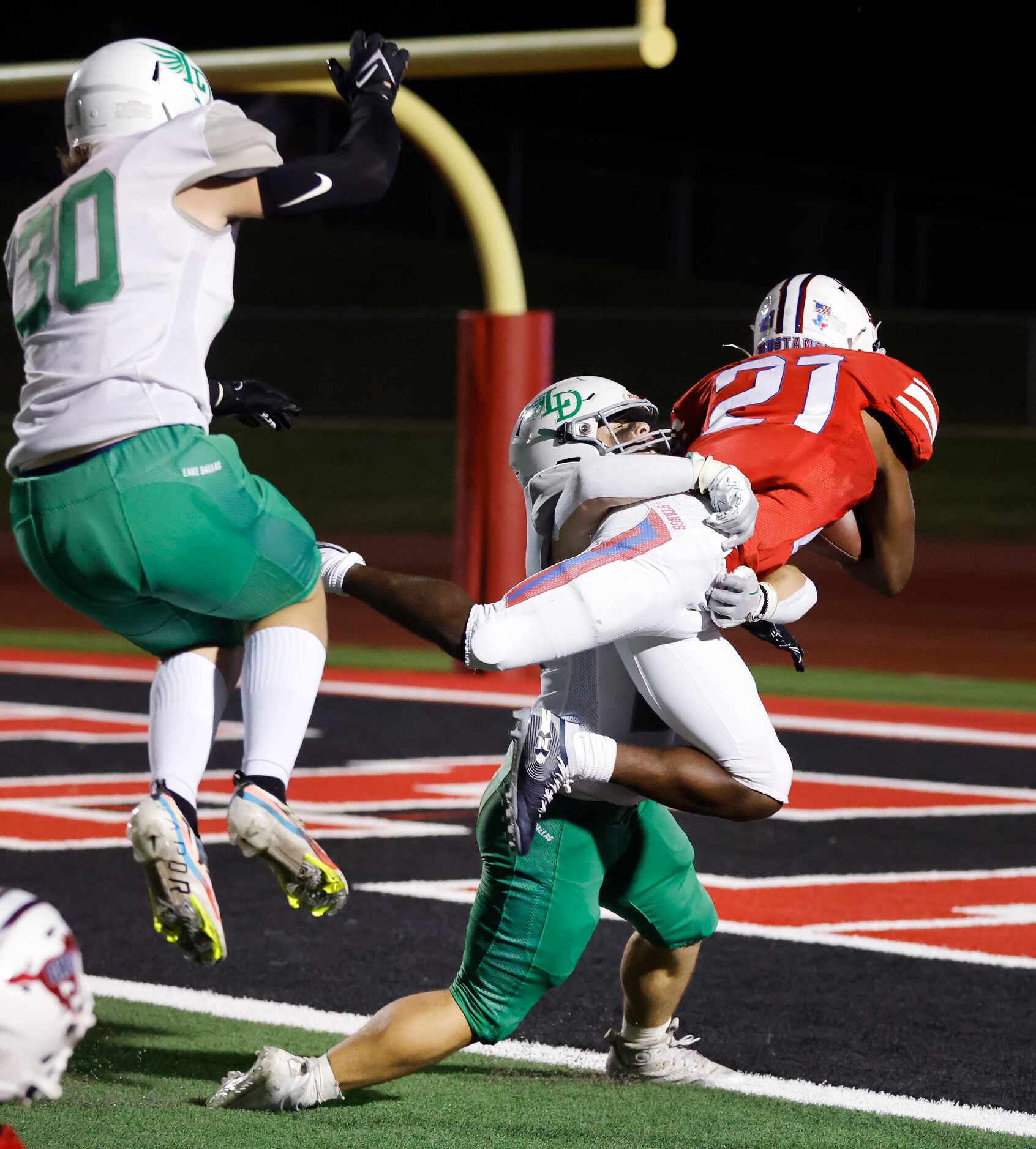 Lake Dallas linebacker Riley Griffin (24) tried to keep Grapevine wide receiver Rondale...
