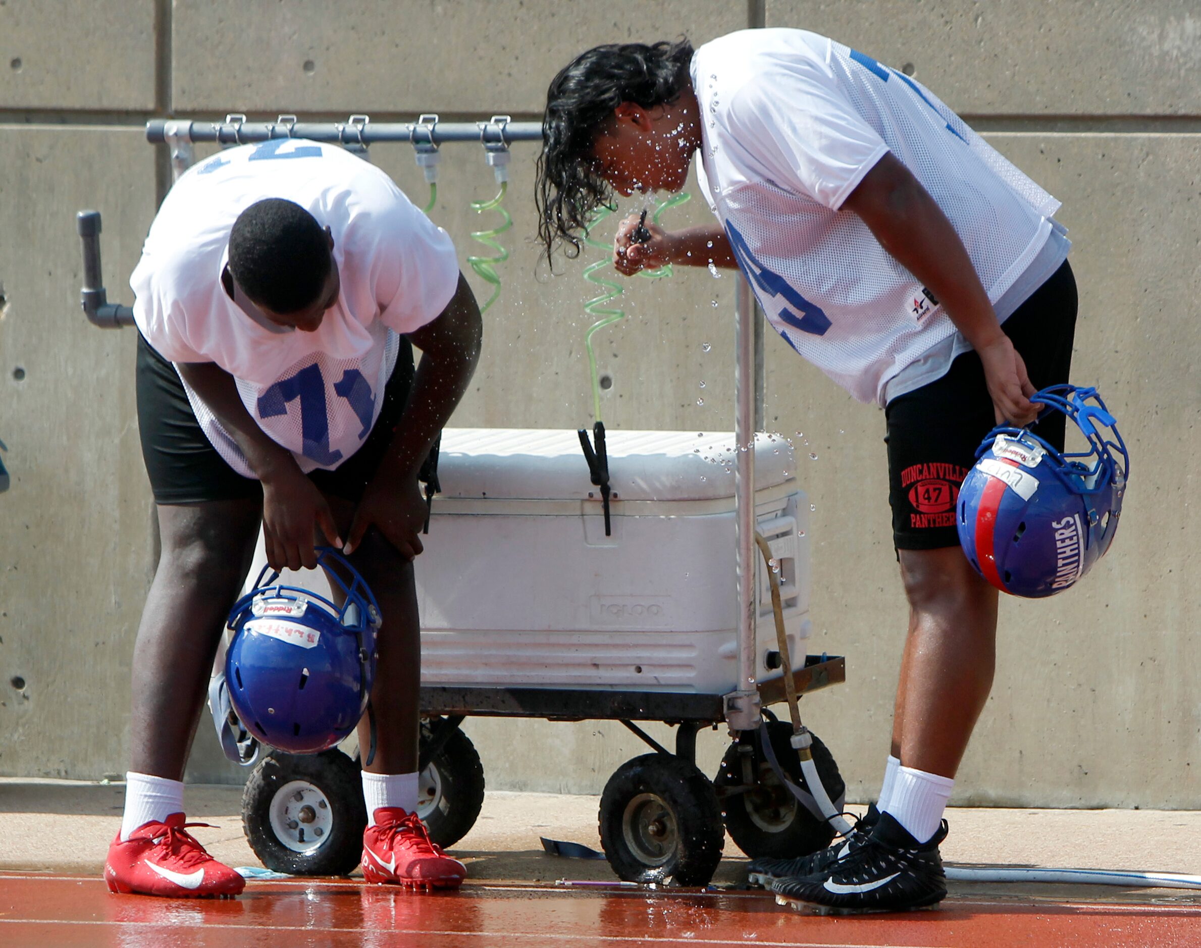 Duncanville Panthers varsity offensive linemen Ben Taylor-Whitfield (71), left, and Louis...