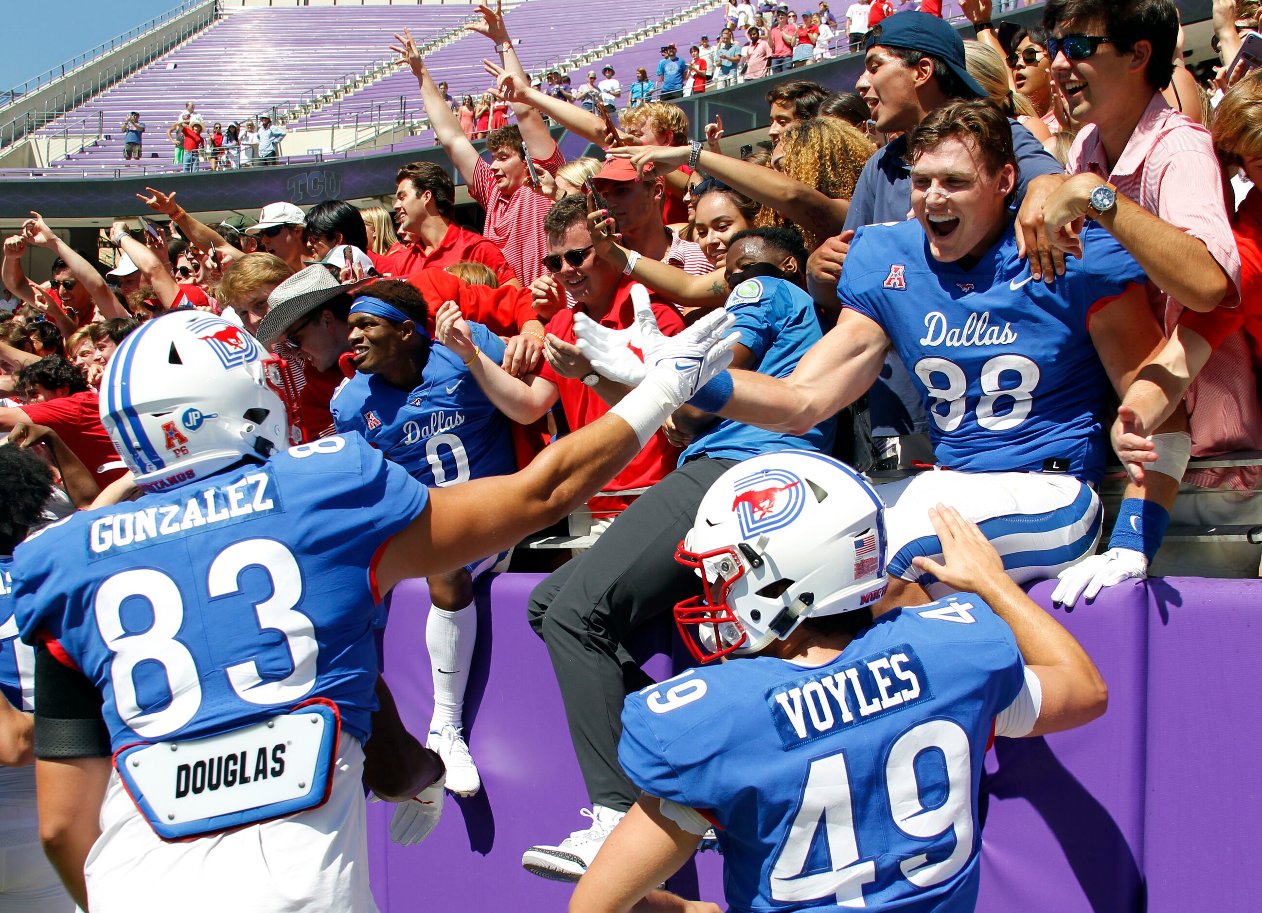 SMU tight end Grant Calcaterra (88), upper right, was all smiles as he shares a...