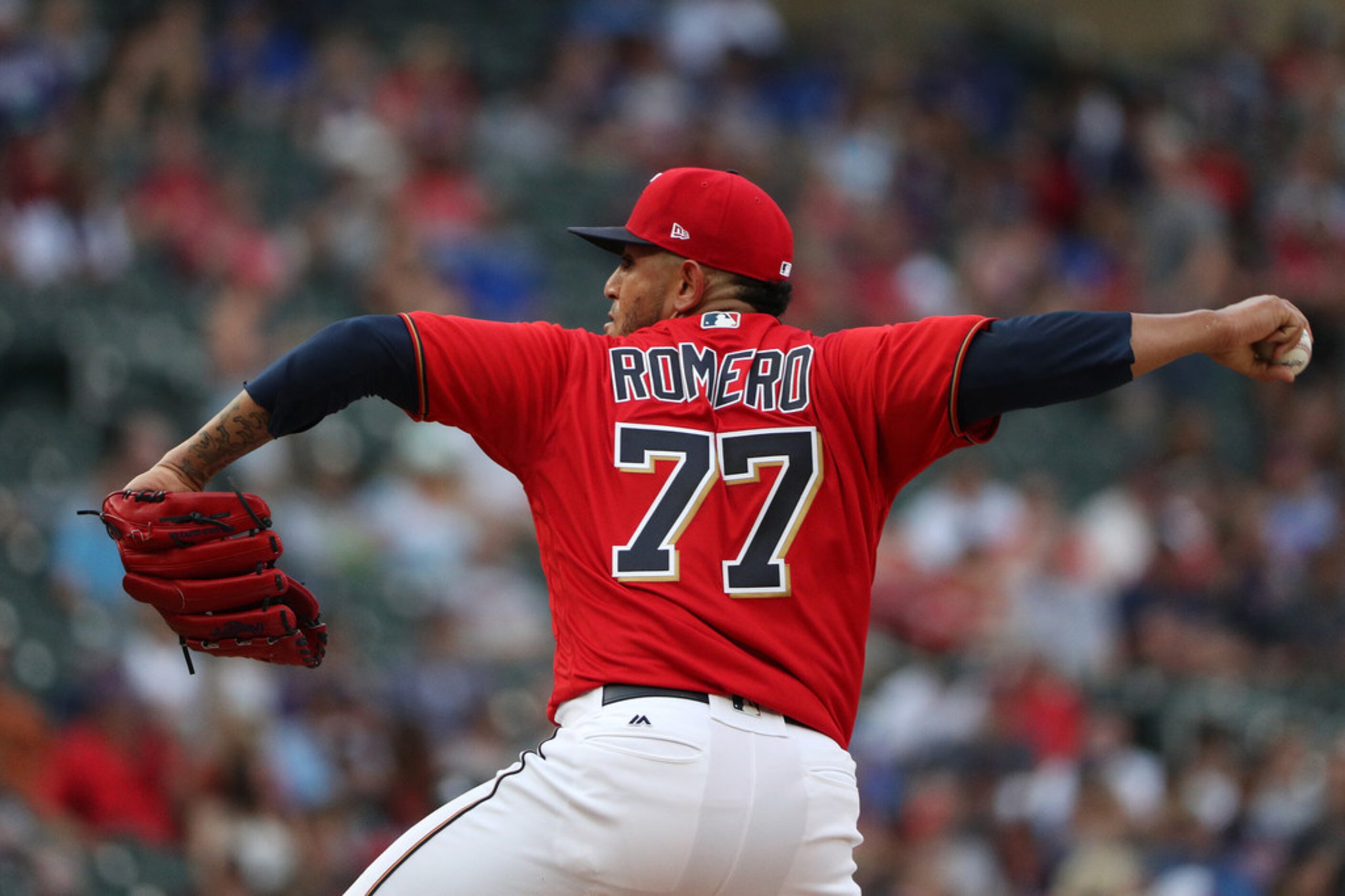 Minnesota Twins starting pitcher Fernando Romero works in the first inning against the Texas...