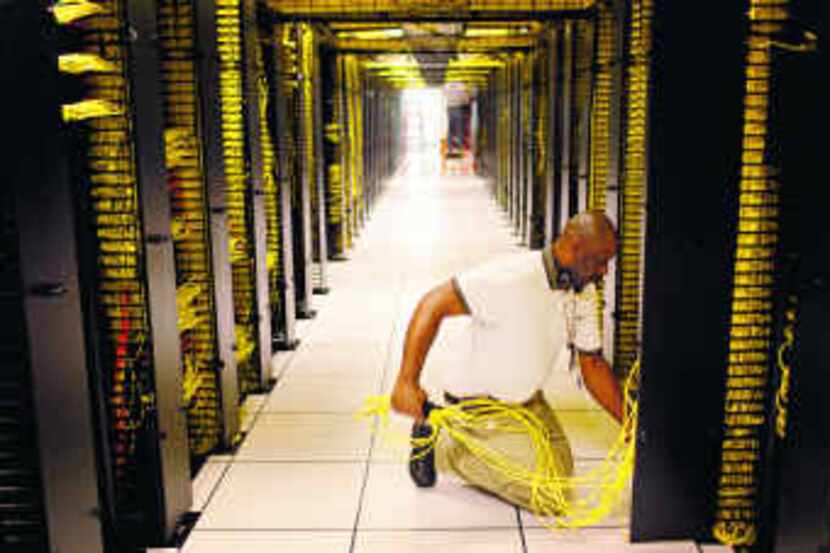 Darrell Dunnaway works in a massive server room at Dell's Plano Technologies Center. 