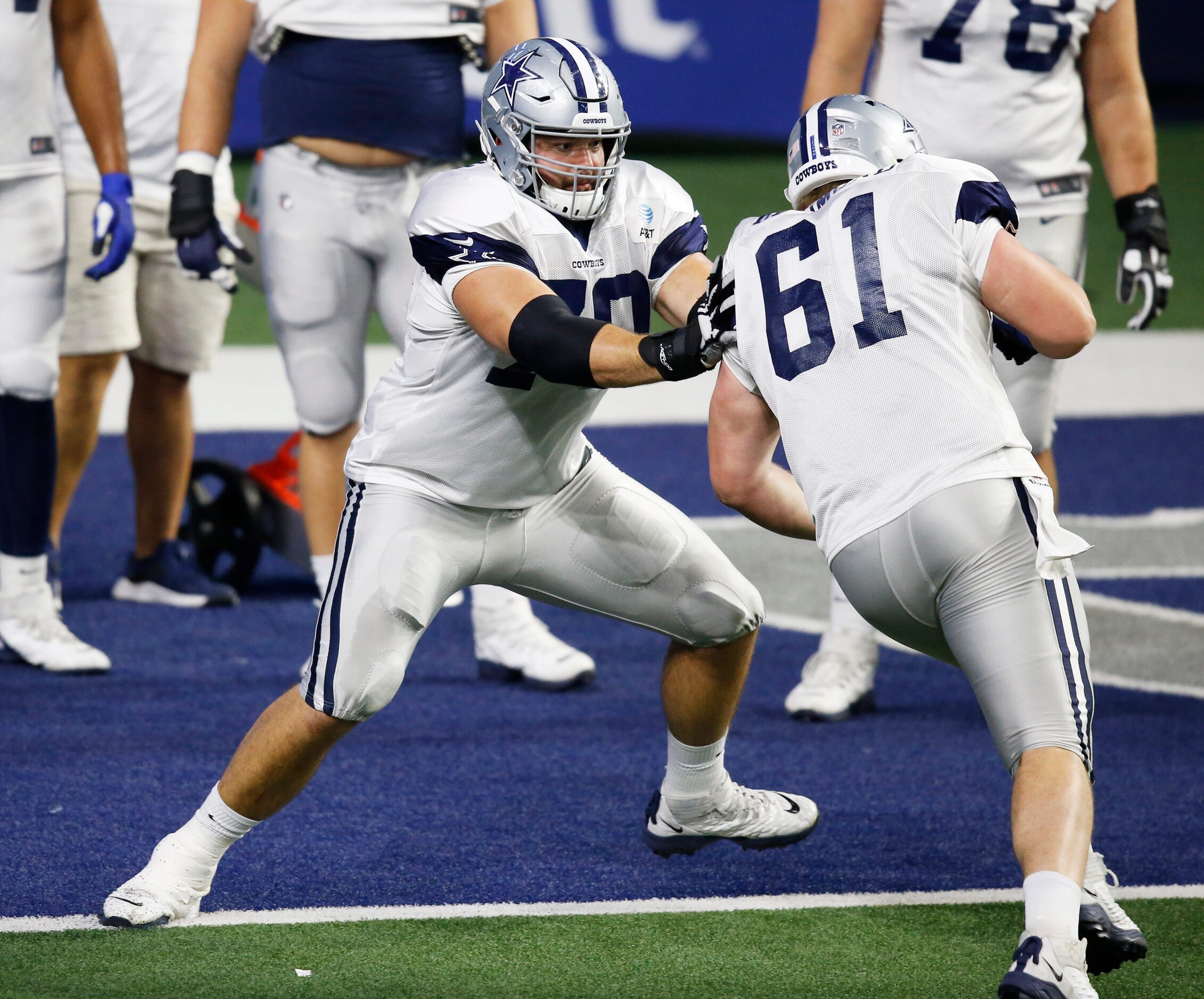 Dallas Cowboys guard Zack Martin (70) blocks Dallas Cowboys center Adam Redmond (61) in a...