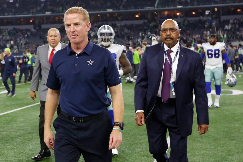 Dallas Cowboys head coach Jason Garrett exits the field after losing to the Seattle Seahawks...