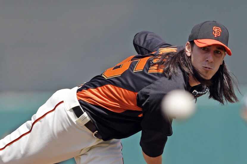 San Francisco Giants starting pitcher Tim Lincecum throws to the Los Angeles Angels during...