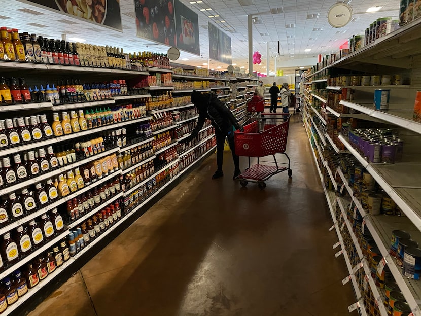 Customers shop on Tuesday at the Target store in Lakepointe Towne Crossing shopping center...