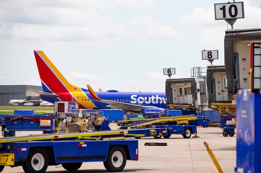 A Southwest Airlines 737 is parked at a gate at Dallas Love Field in Dallas on May 19.