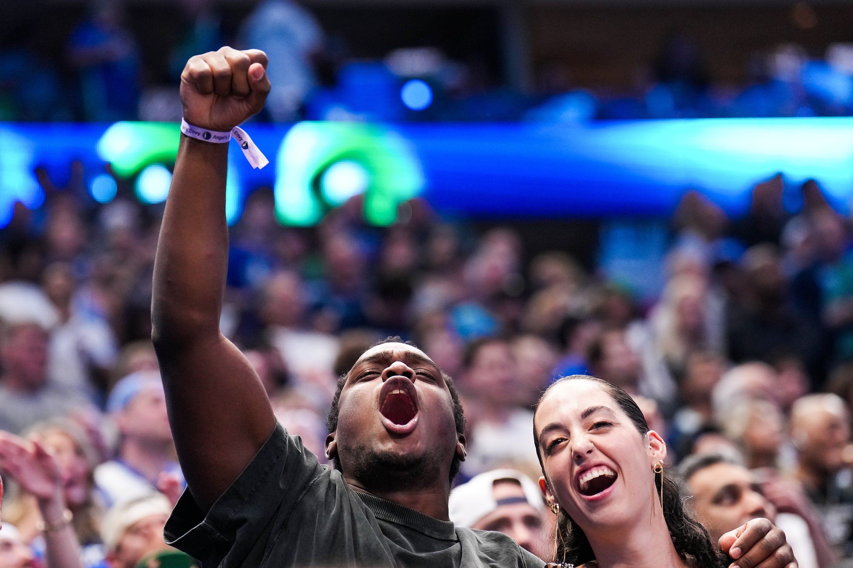 Dallas Mavericks fans cheer during the second half in Game 3 of the NBA basketball Western...