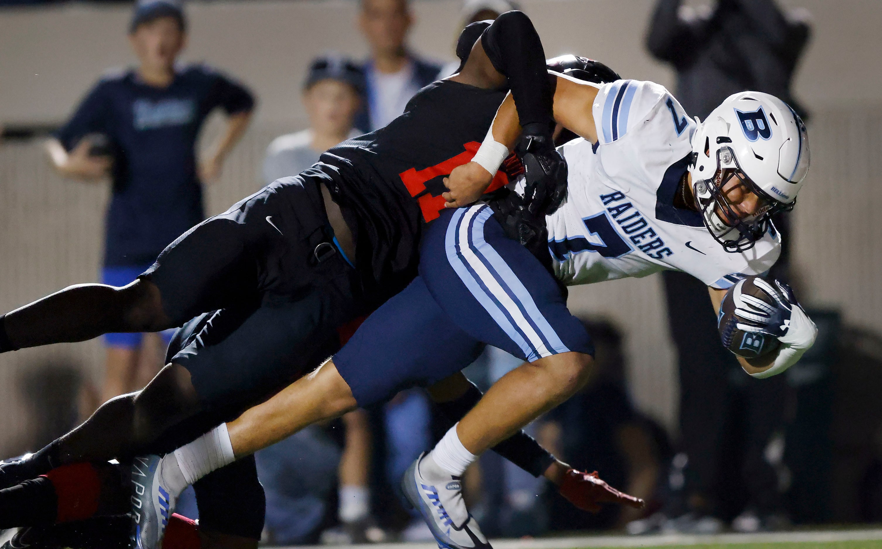 Hurst L.D. Bell quarterback Maddox Olatunde (7) broke several tackles and dragged Euless...