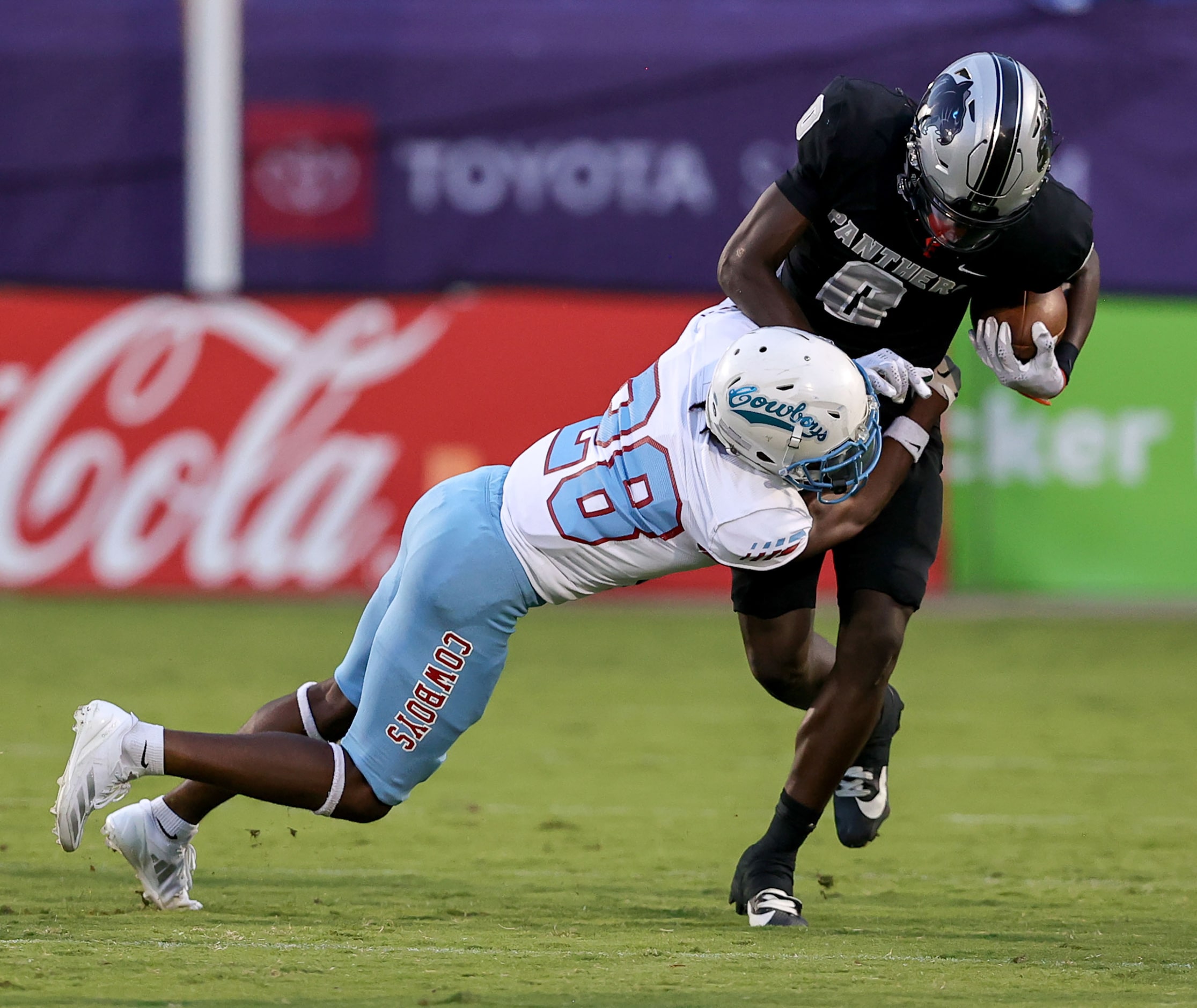 Frisco Panther Creek wide receiver Jalen Lott is stopped by Dallas Carter defensive back...