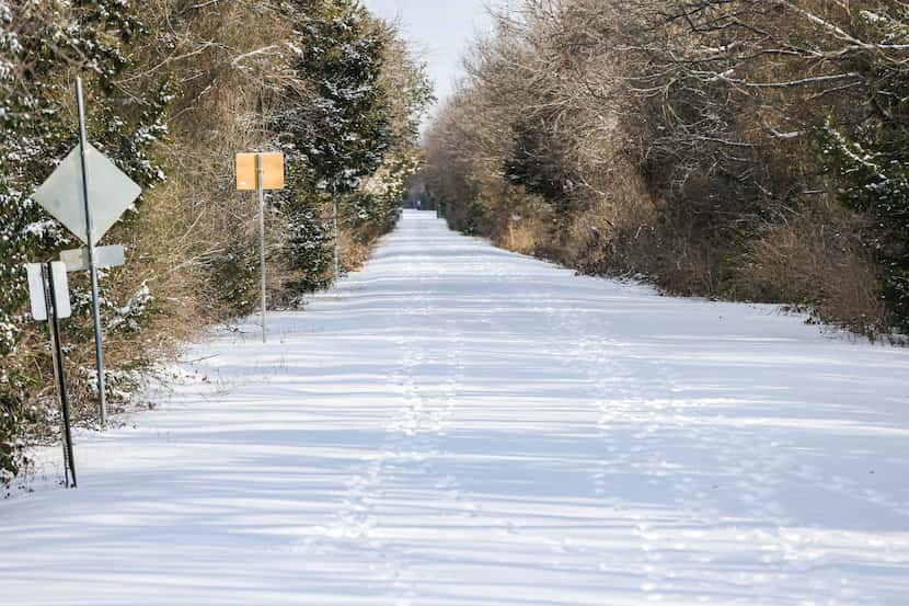 The Santa Fe Trail near Garland Rd covered in snow as a winter storm brings freezing...