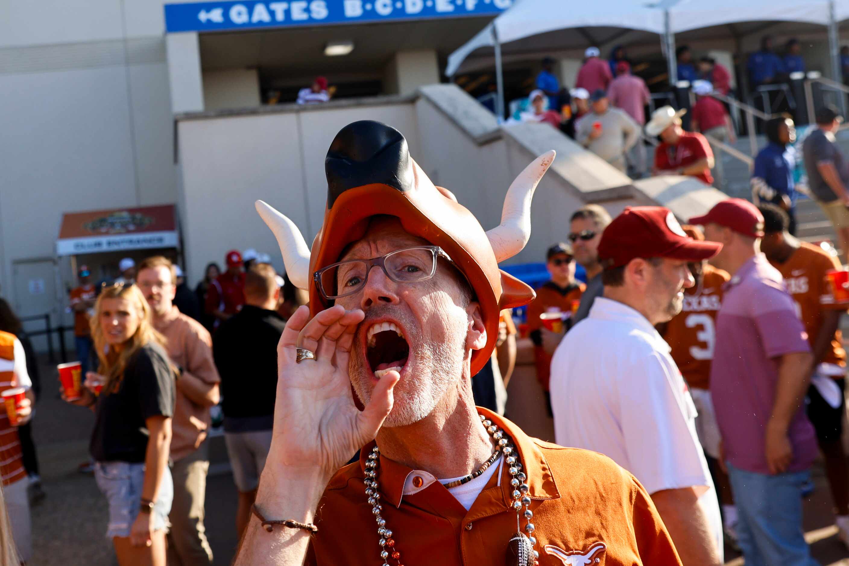 Chris Stewart from Austin cheers ahead of the Red River Showdown at the Cotton Bowl, on...