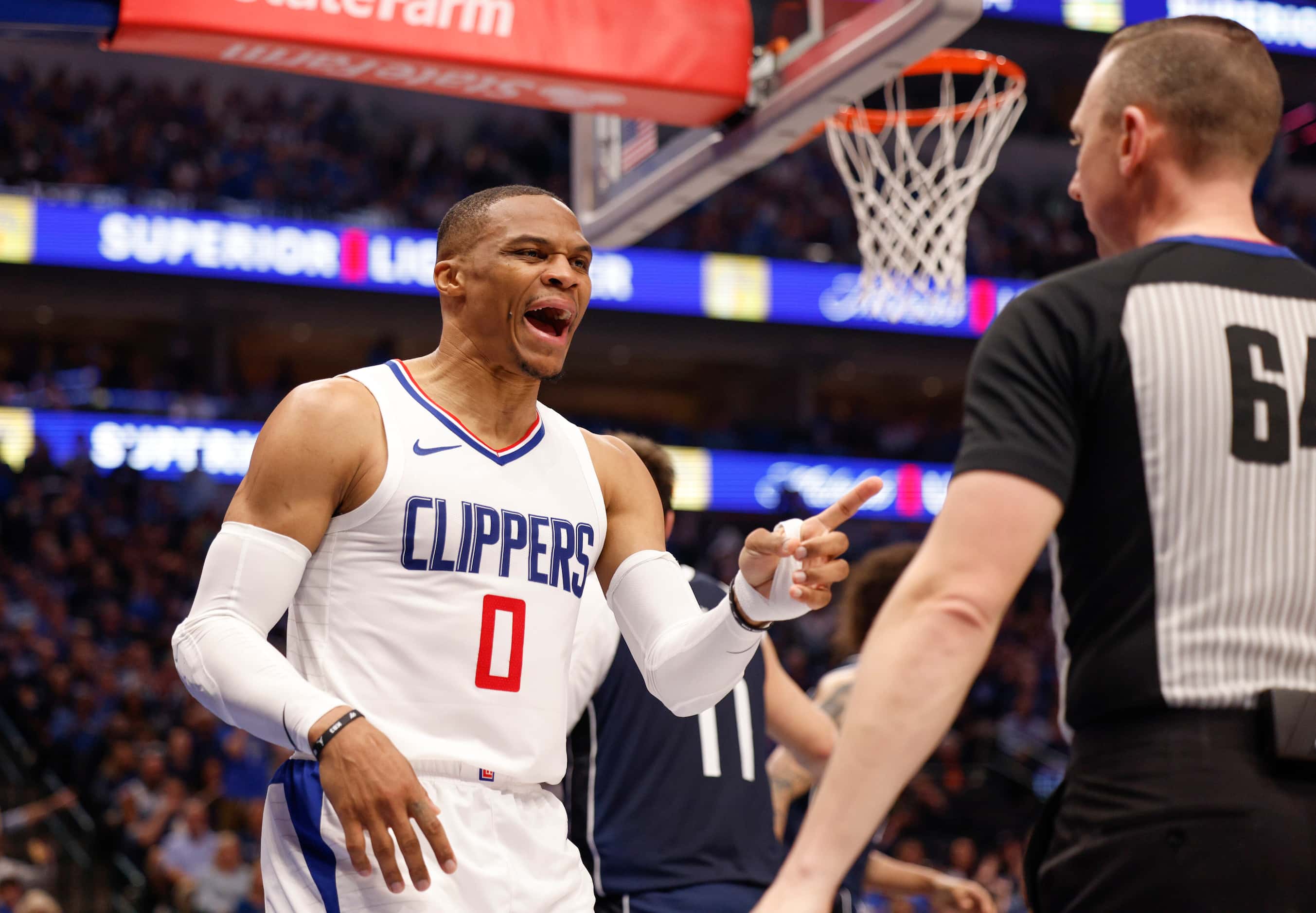 LA Clippers guard Russell Westbrook (0) argues with a referee after being called for a foul...