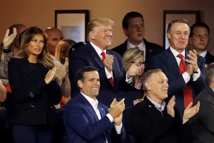 Rep. John Ratcliffe, R-Heath, (blue blazer, one row below the president) attends Game 5 of...