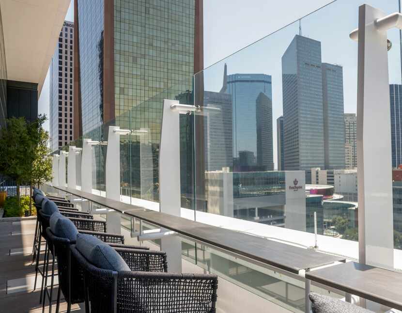 Chairs line the edge of the 11th floor patio space at Vincent’s, one of three new eateries...