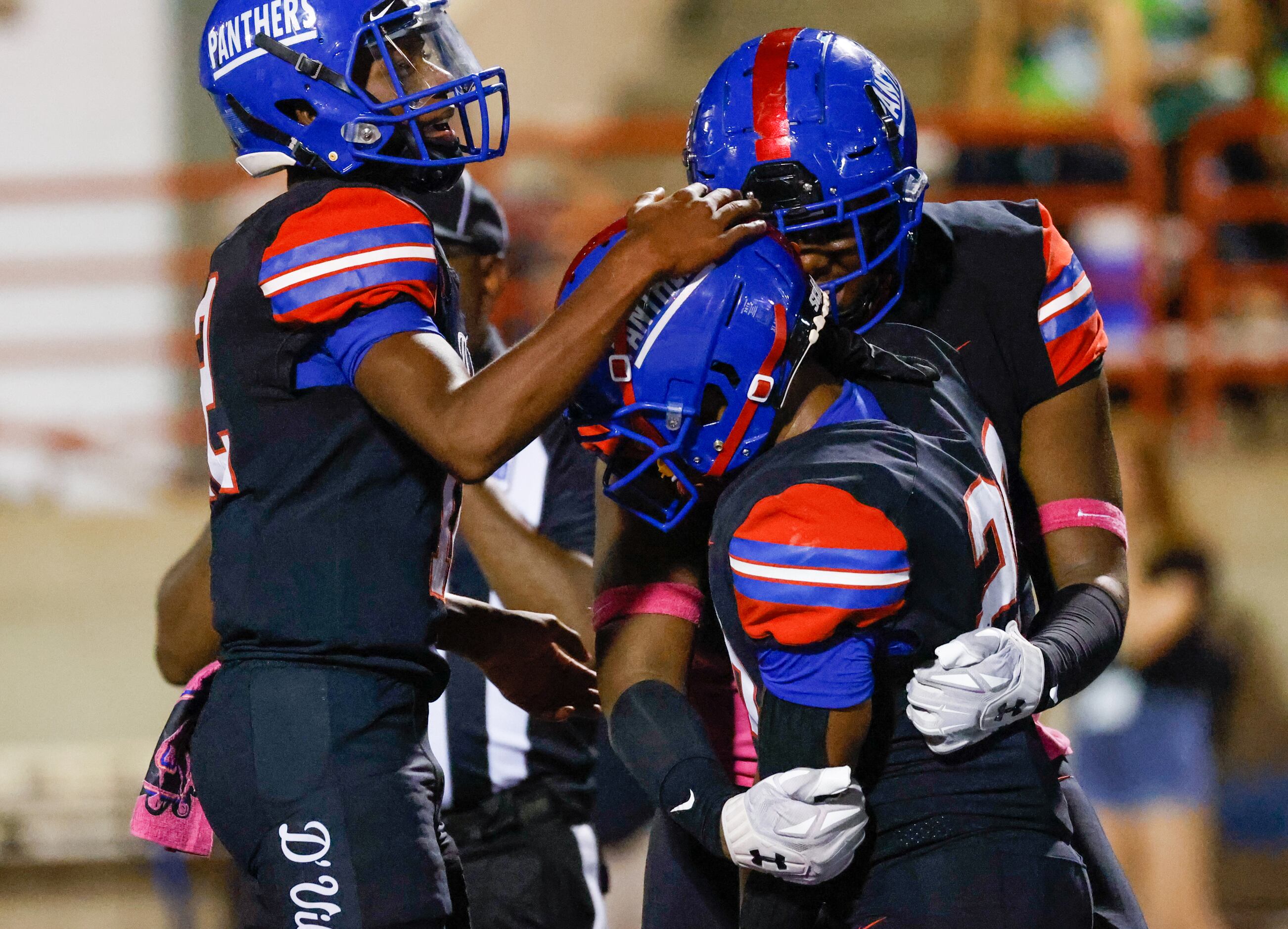 Duncanville running back Caden Durham (29) is greeted with praise from teammates after...