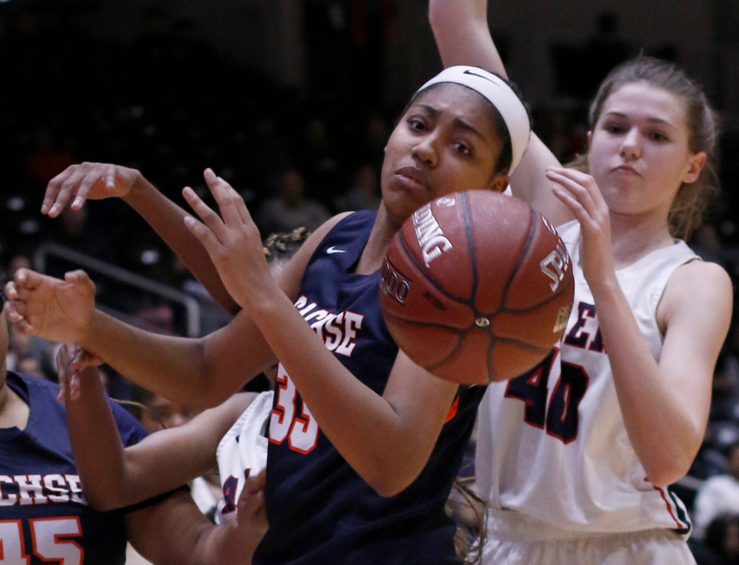 Sachse post Elizabeth Woods (33) eyes the ball as it was knocked from her reach while...