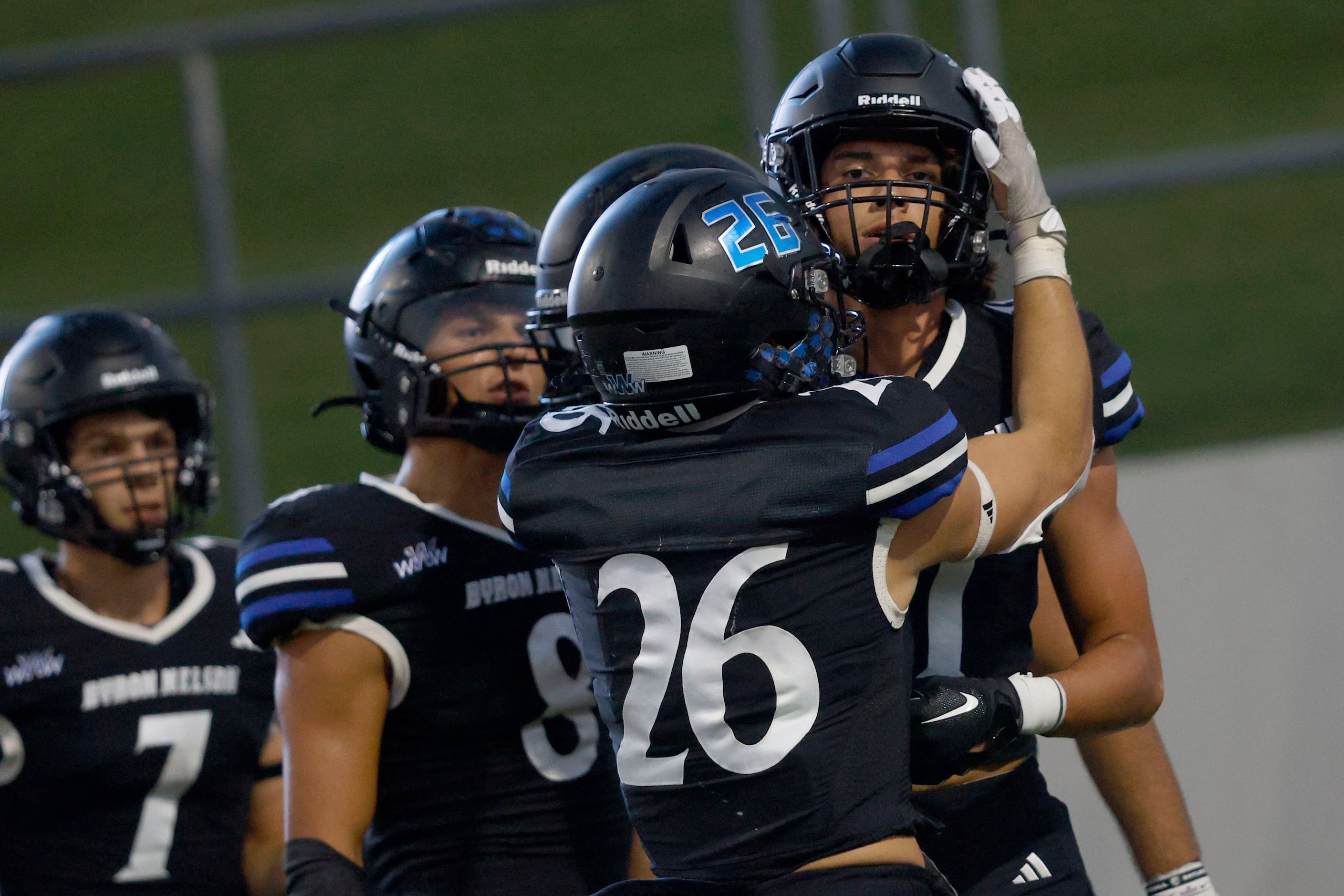 Byron Nelson's Leo Almanza (11) is congratulated by his teammates        after scoring a...