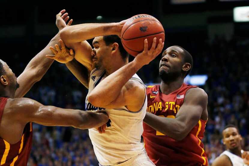 Kansas forward Perry Ellis (34) is fouled by Iowa State forward Melvin Ejim (3) during the...