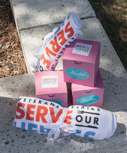 Boxes from Fluellen Cupcakes in Dallas and Serve Our Heroes T-shirts are among the items in...