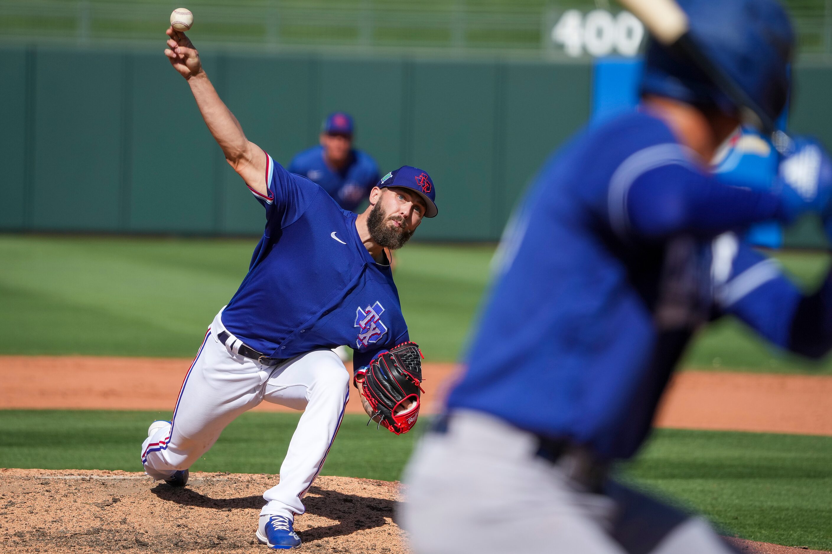 Texas Rangers pitcher Joe Barlow delivers during the ninth inning of a spring training game...