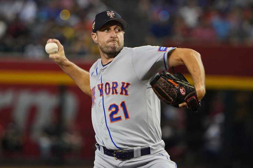 New York Mets pitcher Max Scherzer throws to an Arizona Diamondbacks batter during the first...