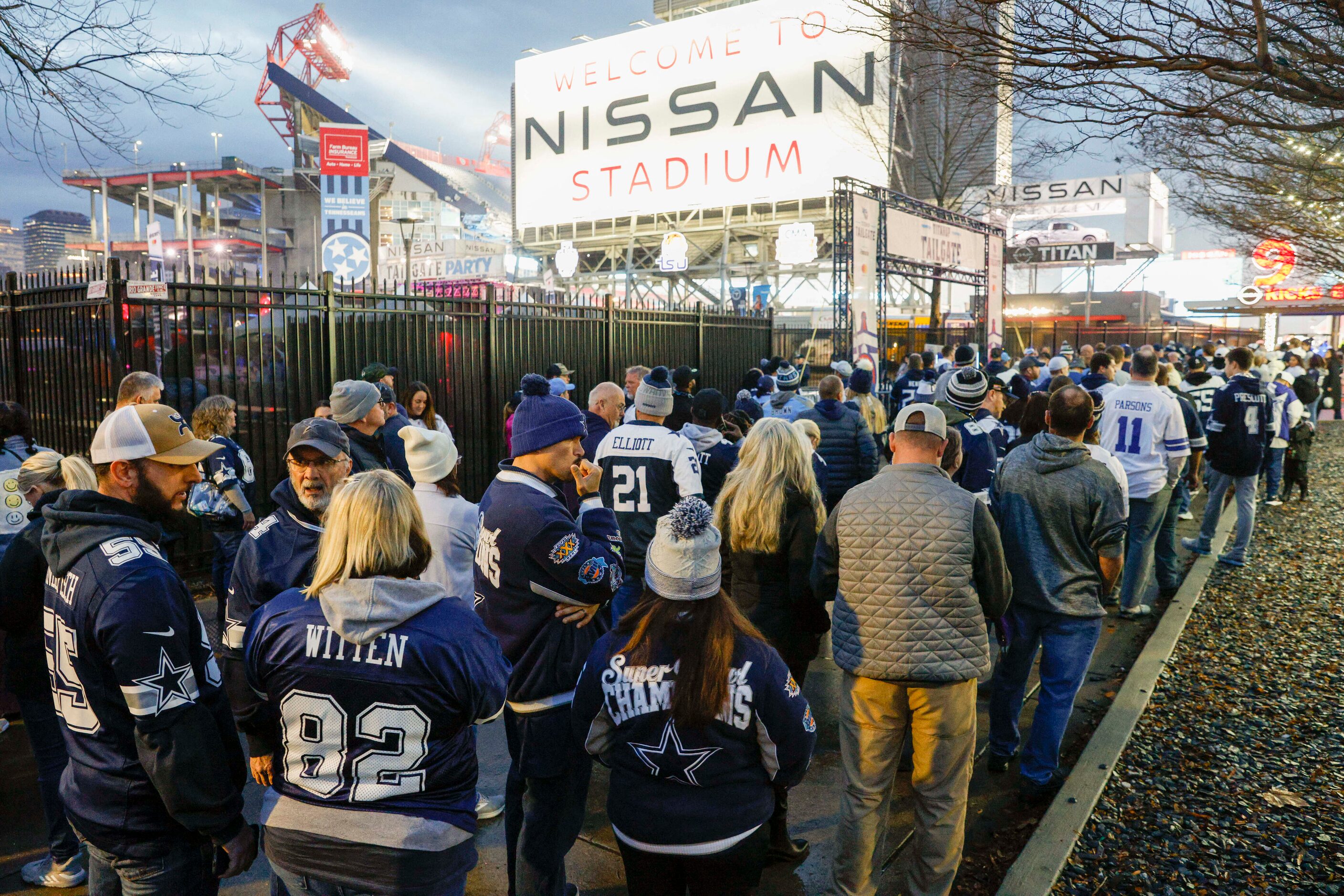 Dozens of Dallas Cowboys fans wait in line before an NFL game against the Tennessee Titans...