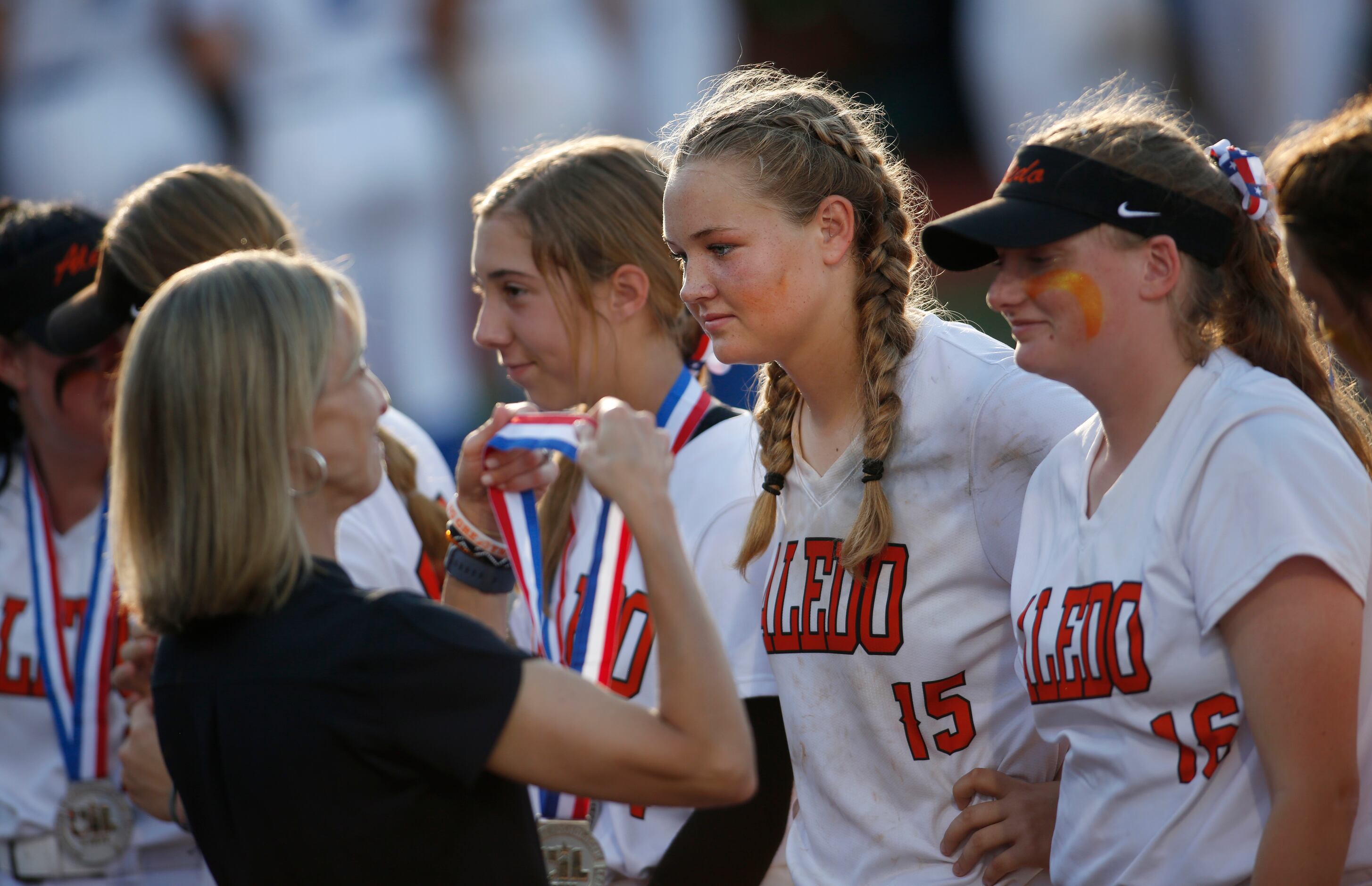 Aledo pitcher Kayleigh Smith (15) prepares to receive her state runner-up medal during the...