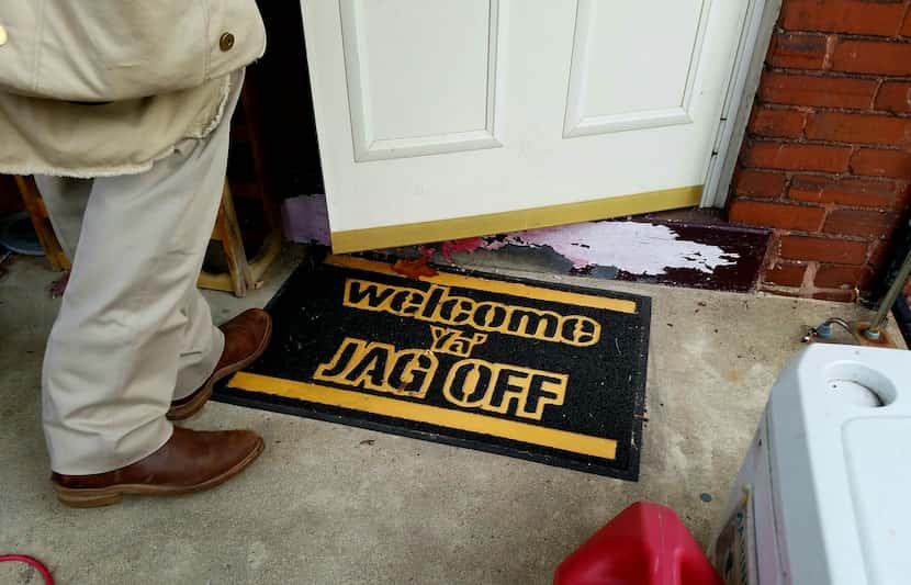 Texas meets Pittsburgh. Tom Dans' cowboy boots are welcomed by a Steelers-themed doormat at...