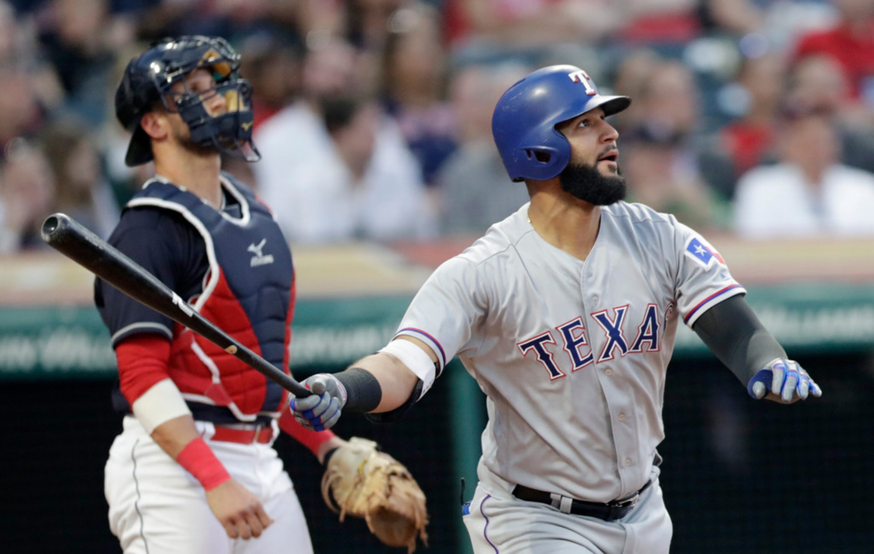 Texas Rangers' Nomar Mazara watches his ball after hitting a two-run home run off Cleveland...