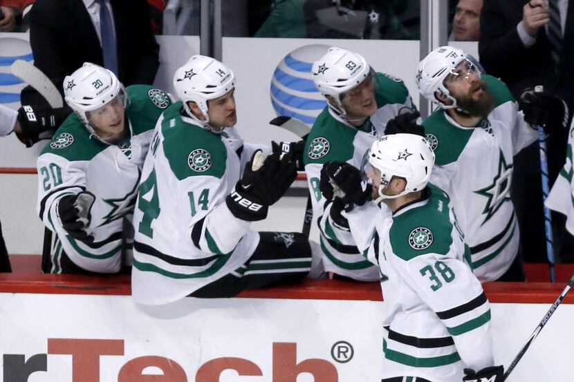 Dallas Stars' Vernon Fiddler (38) celebrates with teammates his first goal during the first...