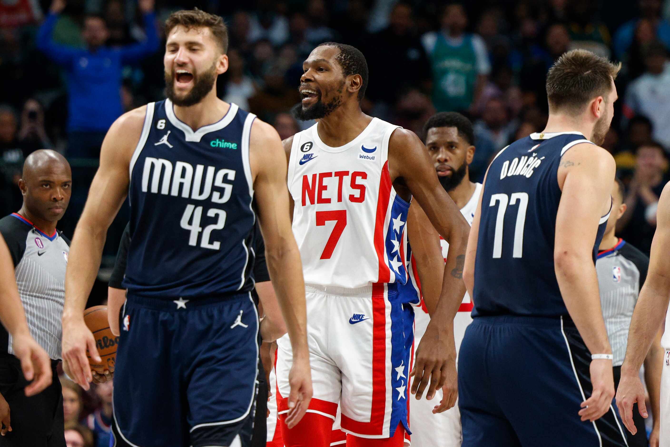 Brooklyn Nets forward Kevin Durant (7) yells towards the Dallas Mavericks bench during the...