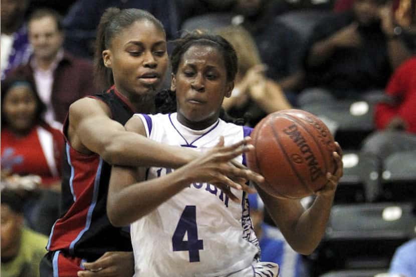 Breanna Hayden (4), Lincoln's leading scorer with 19 points, is harassed by Skyline's...