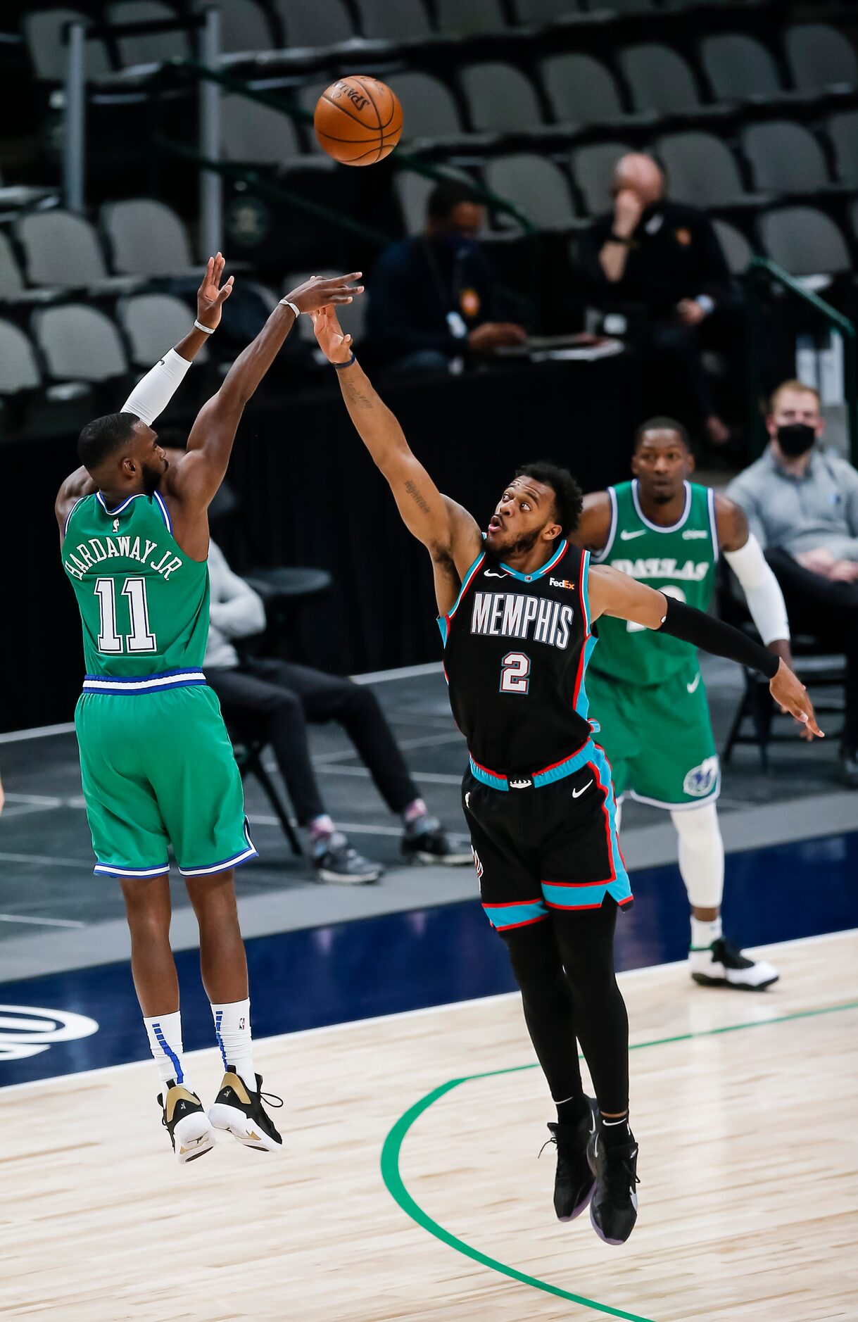 Dallas Mavericks forward Tim Hardaway Jr. (11) attempts a shot as Memphis Grizzlies forward...