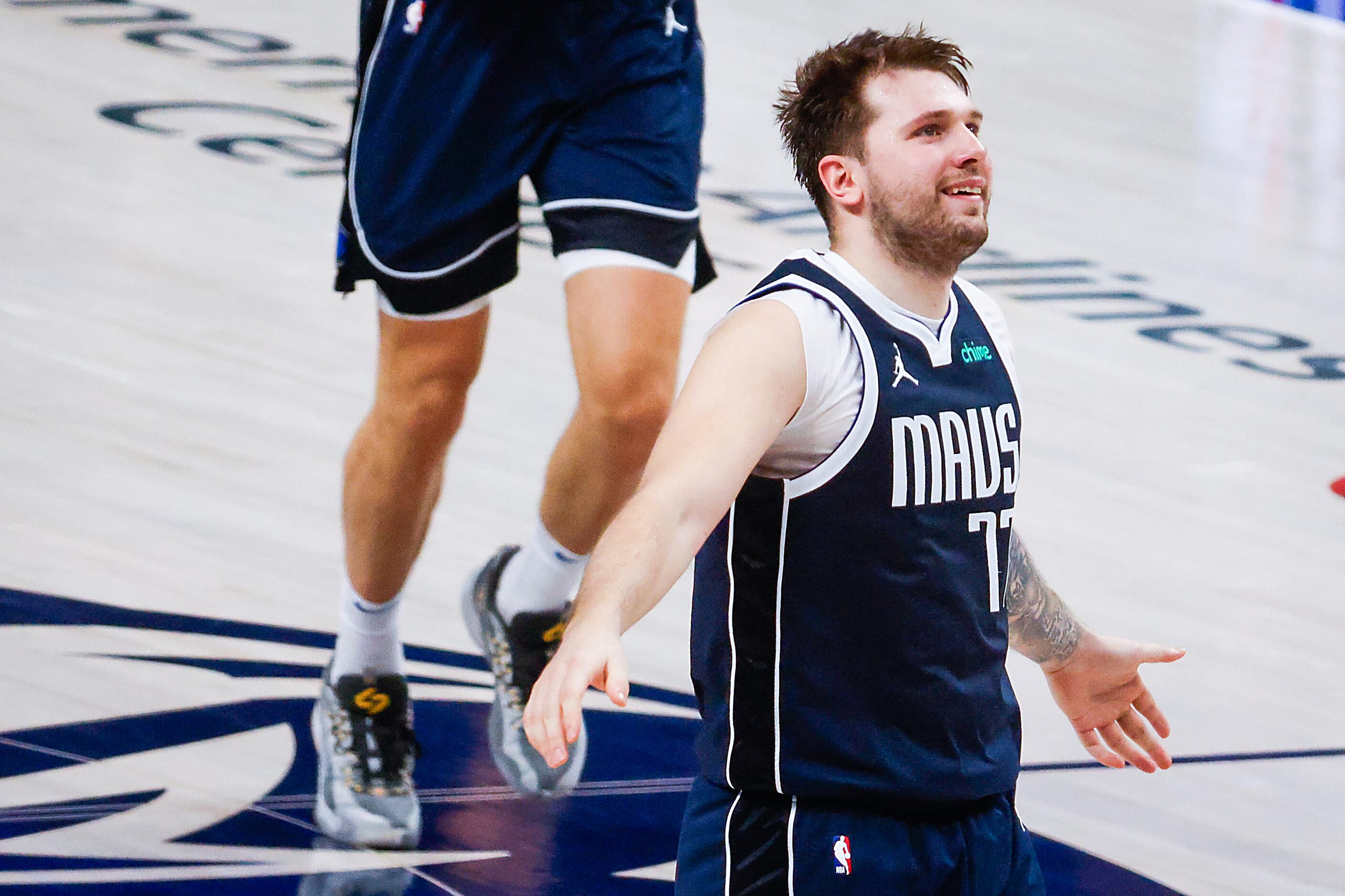 Dallas Mavericks guard Luka Doncic reacts after a three-pointer against the LA Clippers...