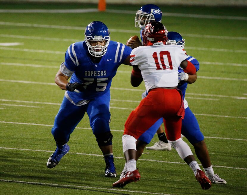 Grand Prairie Demarcus Marshall (75) blocks Duncanville's Marcus Mosley (10)during their...