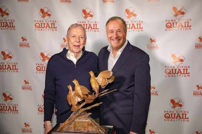 Johnny Morris (right), Bass Pro Shops founder, poses with T. Boone Pickens after receiving...