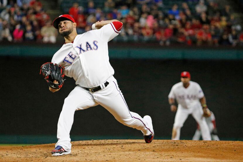Texas Rangers starting pitcher Martin Perez (33) throws a first-inning pitch during the...