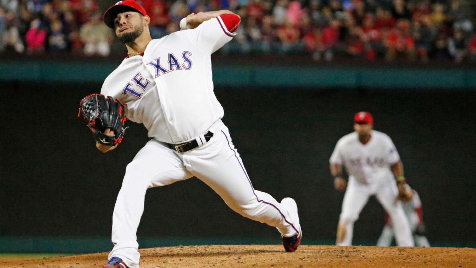 Texas Rangers starting pitcher Martin Perez (33) throws a first-inning pitch during the...