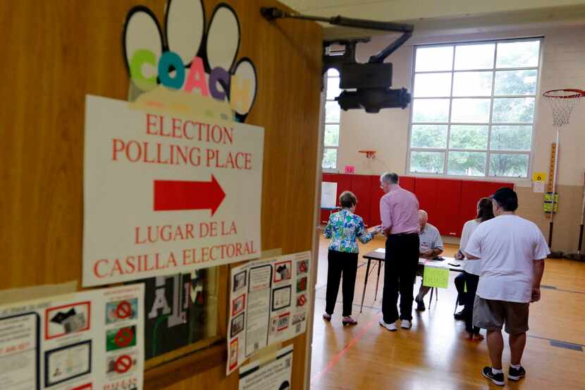  Voters gathered Saturday at the  polling site at Lake Highlands Elementary School. (Rose...