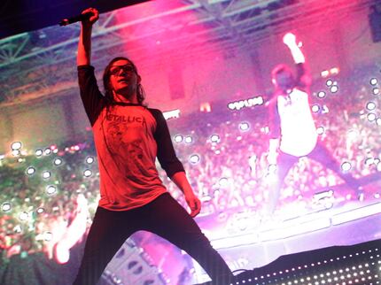 Skrillex performs during the Lights All Night festival at the Dallas Convention Center in...
