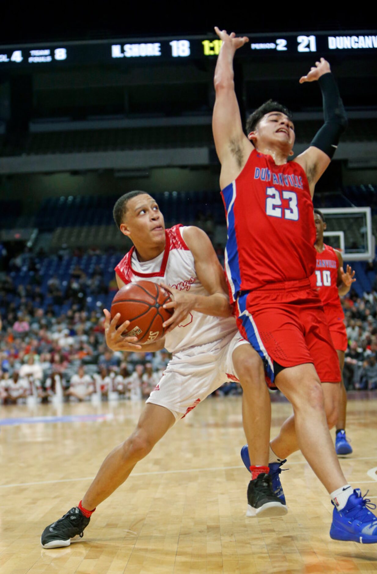 Galena Park North's Joshua Cooper #0 is guarded by Duncanville's Derek Luna #23. UIL boys...