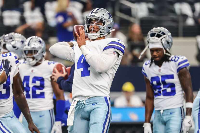 Dallas Cowboys' quarterback Dak Prescott (4) during pregame warmups at AT&T stadium in...