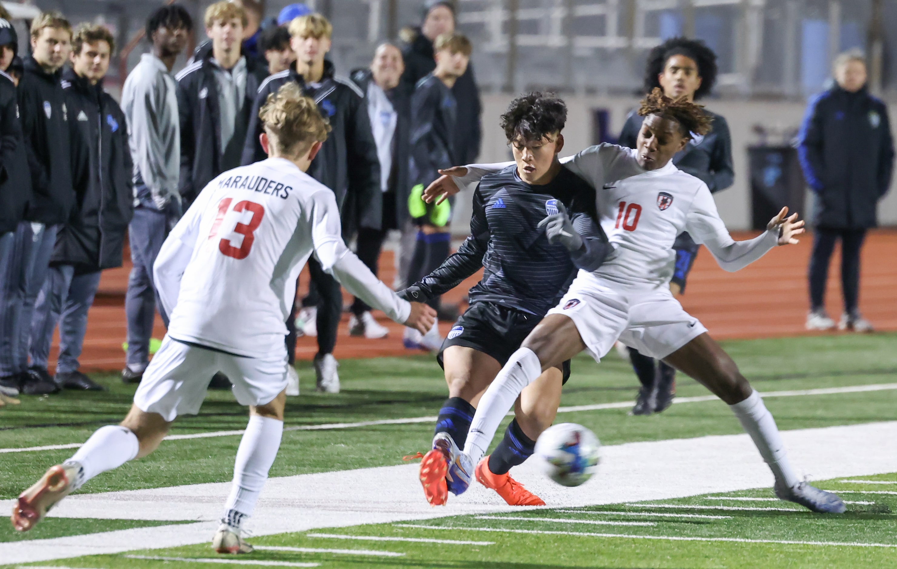 Flower Mound Marcus’ Aaron Pondeca (10) moves in front of the ball to take it from Hebron’s...