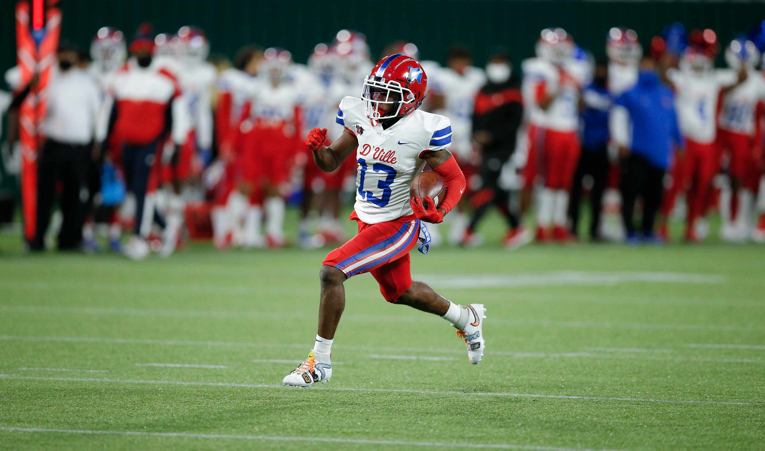 Duncanville junior running back Da'Myrion Coleman (13) carries the ball in for a touchdown...