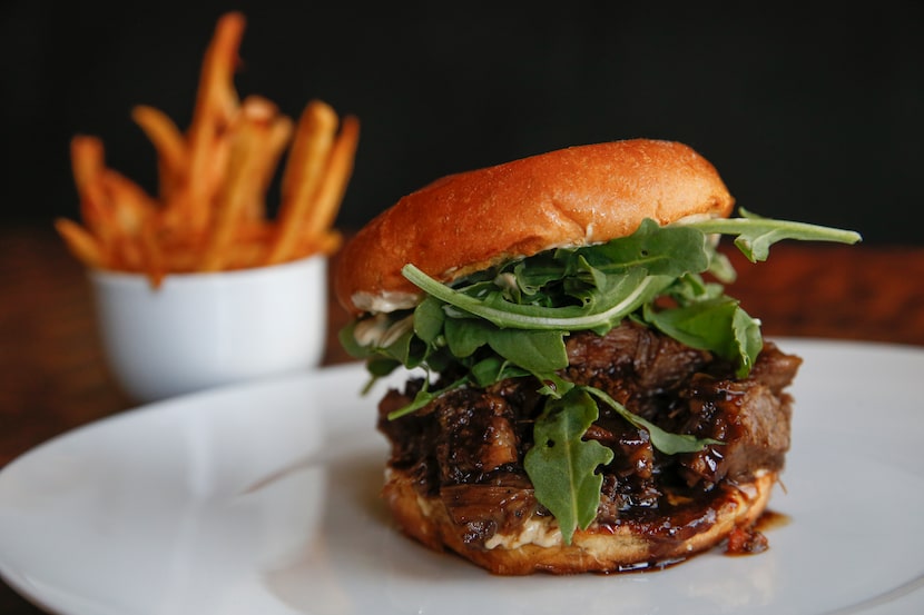 A braised short rib sandwich and fries at Local restaurant in Deep Ellum